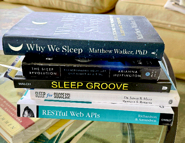 A stack of books about sleep